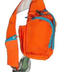Vibrant Orange Sling Backpack with Blue Accents
